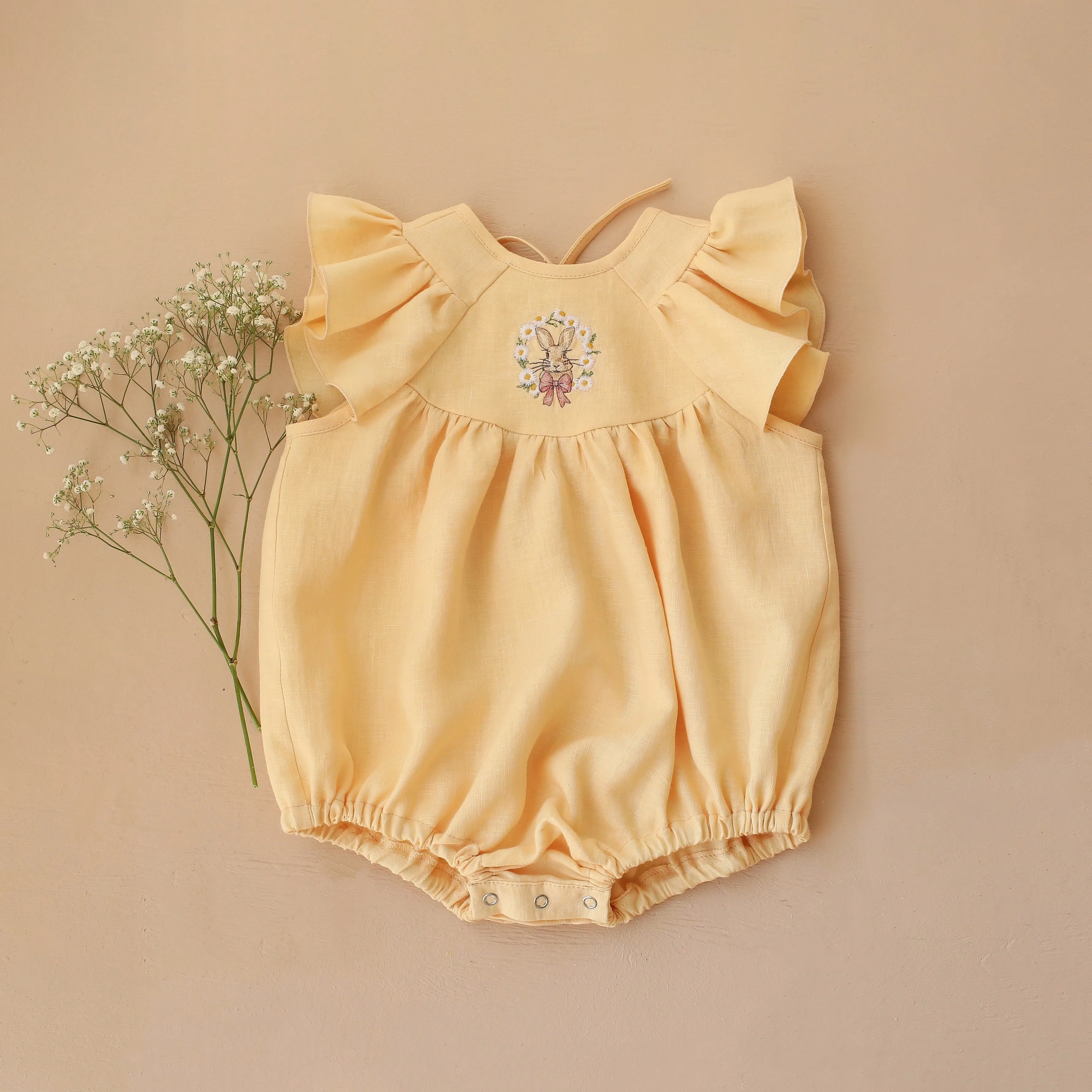 Vanilla Linen Flutter Sleeve Tie Back Bubble Playsuit with "Bunny in Daisy Wreath" Embroidery